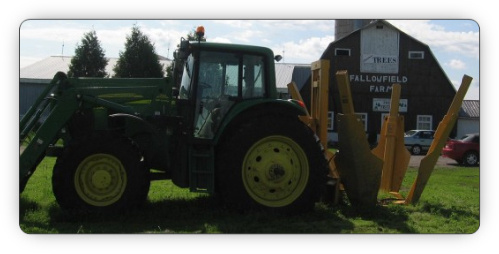Ottawa Fallowfield Tree Farm tree scoop and bucket tractor of tree transplanting, moving and removal - 613-720-3451